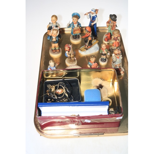 18 - Twelve Hummel figures and two small dishes, costume jewellery and watches.