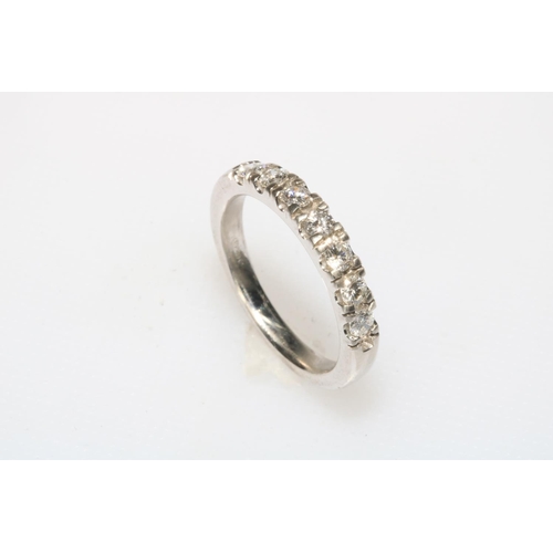 195 - 18 carat white gold seven stone diamond half eternity ring, size O.