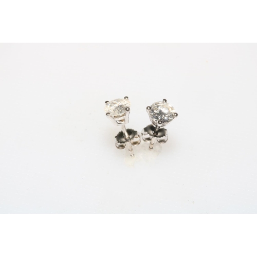 201 - Pair of 18 carat white gold and brilliant cut diamond stud earrings, approximately 1.07 carats.