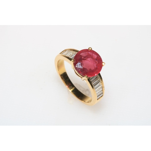 202 - 18 carat yellow gold ruby and diamond ring, the central circular 3.26 carat ruby flanked by seven ba... 