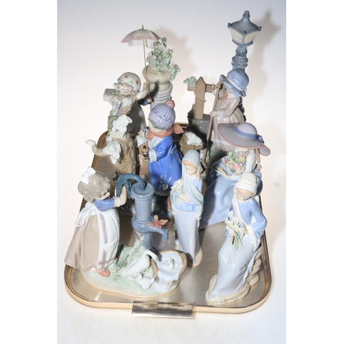 22 - Seven Lladro figures and groups.