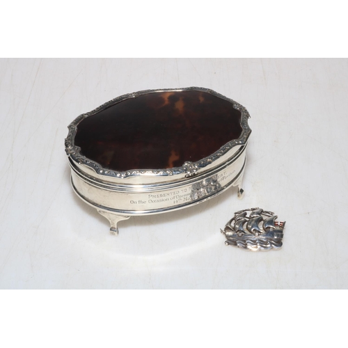 247 - Silver and tortoiseshell oval ring box with ornate border, Birmingham 1927, and silver ship brooch, ... 