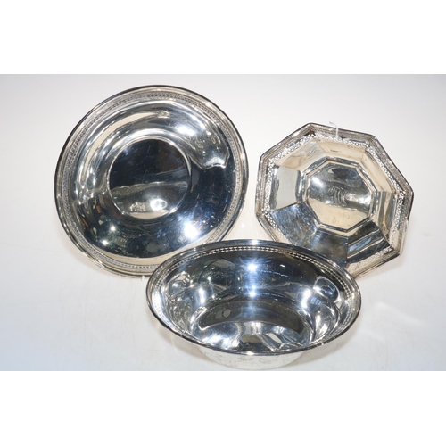 254 - Three sterling silver dishes, one octagonal with pierced decoration, largest 25.5cm diameter.