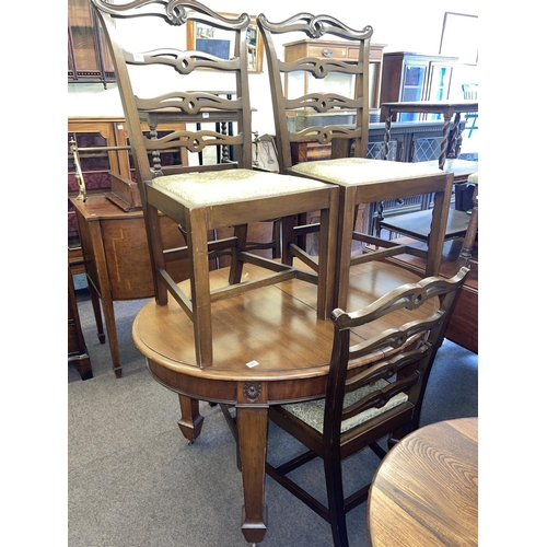 340 - Edwardian oval mahogany extending dining table, leaf and winder, four ladder back dining chairs, two... 