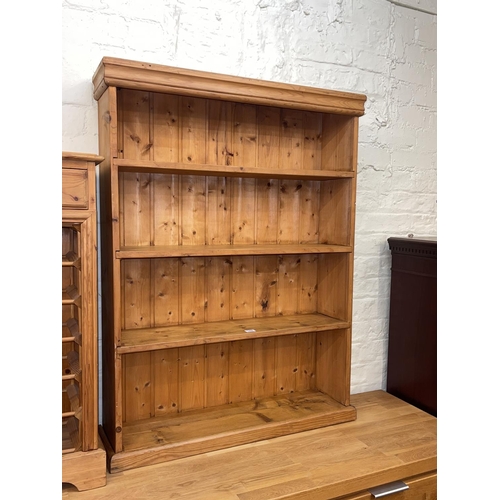 348 - Pine four tier open bookcase, 108cm by 82cm by 21cm.