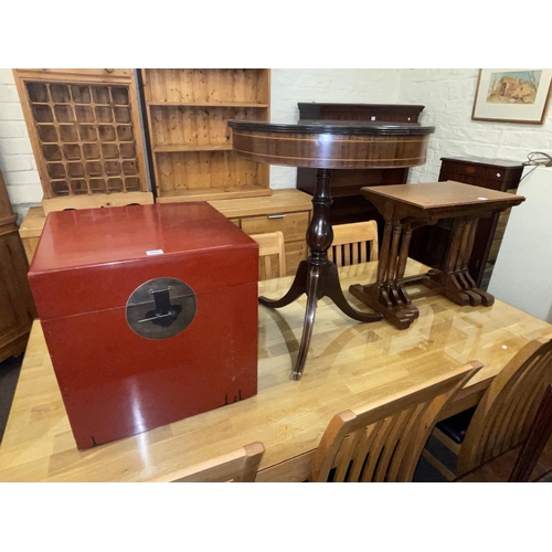 352 - Oak nest of three tables, circular mahogany tripod occasional table and red lacquered trunk (3).