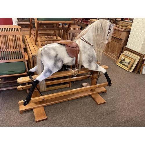 363 - Cookham Dean Relko large dapple grey rocking horse on safety stand, 125cm by 147cm.