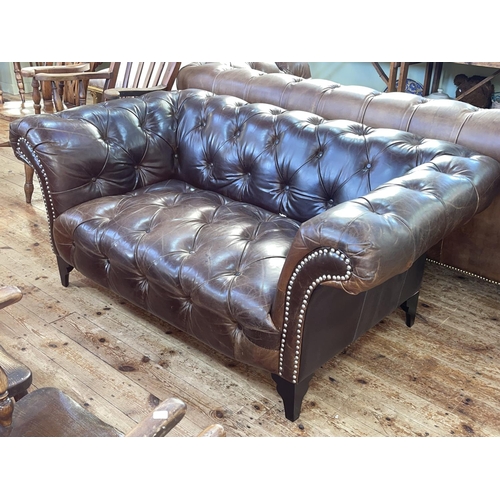 394 - Barker & Stonehouse brown deep buttoned and studded leather Chesterfield settee, 70cm by 164cm by 95... 