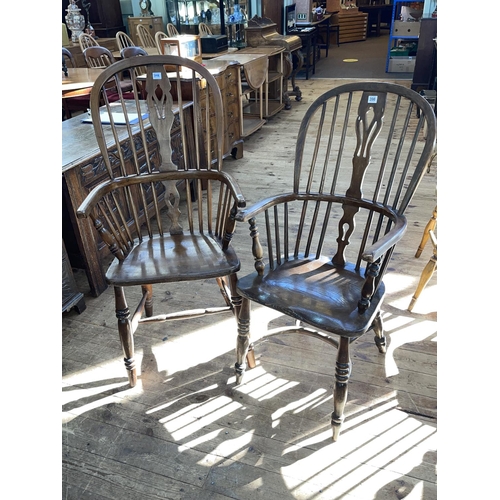 398 - Two antique Windsor pierced splat back elbow chairs, one with crinoline stretcher.