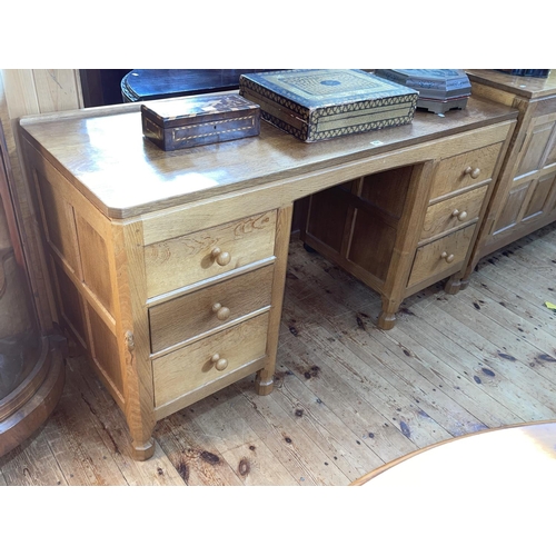 424 - Robert Thompson of Kilburn 'Mouseman' adzed oak six drawer pedestal dressing table, 73cm by 137cm by... 