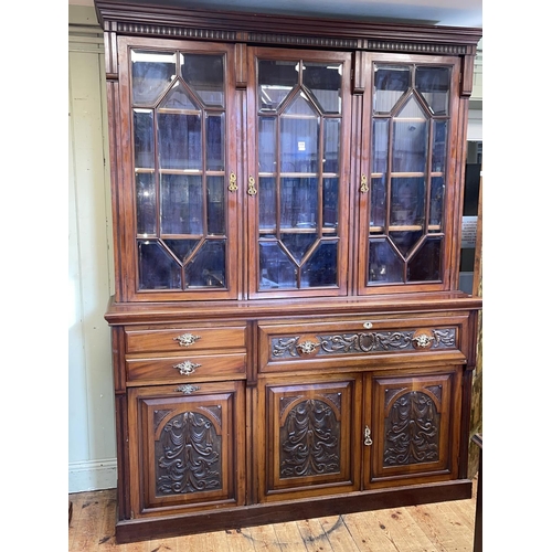 439 - Victorian carved walnut library secretaire bookcase having three astragal glazed doors above a secre... 