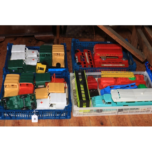 46 - Four boxes of vintage toy vehicles including buses and ambulances.