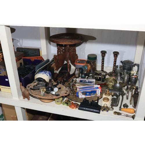 87 - Full shelf of collectables including chess pieces and boards, metalware, carved wood pieces includin... 