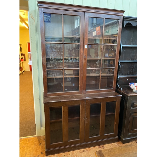 436 - Early 20th Century mahogany cabinet bookcase having four glazed panel doors, 217cm by 125cm by 48cm.