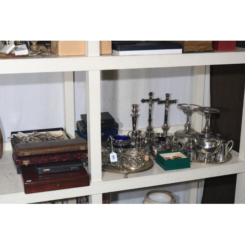 100 - Collection of silver plated wares including cased cutlery, candle holders, serving trays, etc.