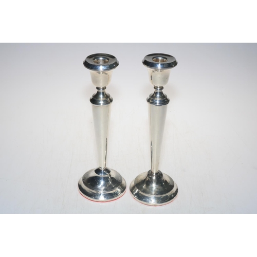 264 - Pair of large loaded silver candlesticks, 29cm high, marks worn.