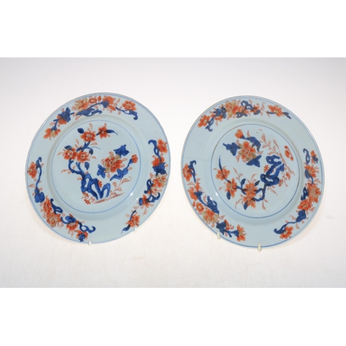 128 - Pair of 18th Century Chinese Imari pattern plates, 23cm diameter.