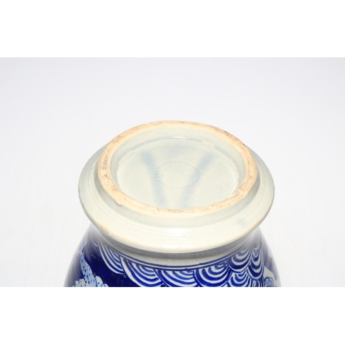 136 - Large blue and white vase decorated with mythical dragon and floral design, 30cm high.