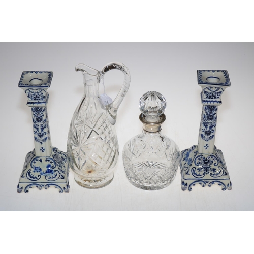3 - Birmingham silver mounted decanter, cut glass jug and pair of blue and white Delft candlesticks.