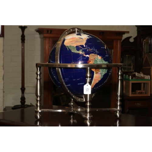 73 - Semi-precious stone terrestrial globe and on four legged stand with centralised compass with box.
