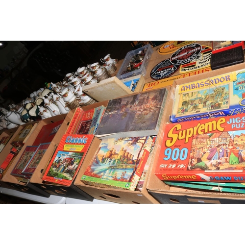 99 - Seven boxes of vintage jigsaw puzzles.