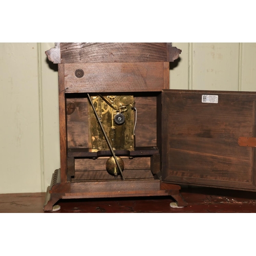 166 - A large mahogany mantel clock on bracket feet, having arched dial, 48cm high.