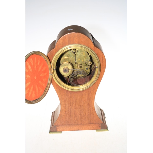 168 - Mahogany balloon clock marked 'Seth Thomas in USA', 31cm high.