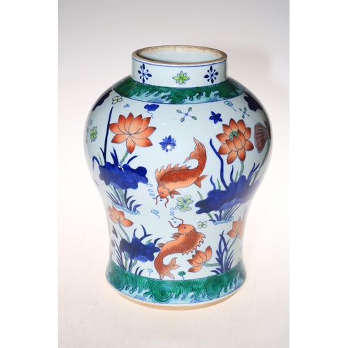 180 - Large Chinese vase of bulbous form decorated with fish and marine fauna, square mark to base, 34cm.