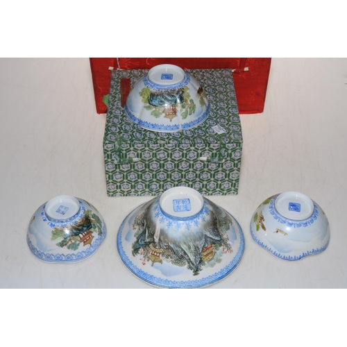 184 - A collection of five Chinese eggshell porcelain bowls, each decorated with temple in landscape, larg... 