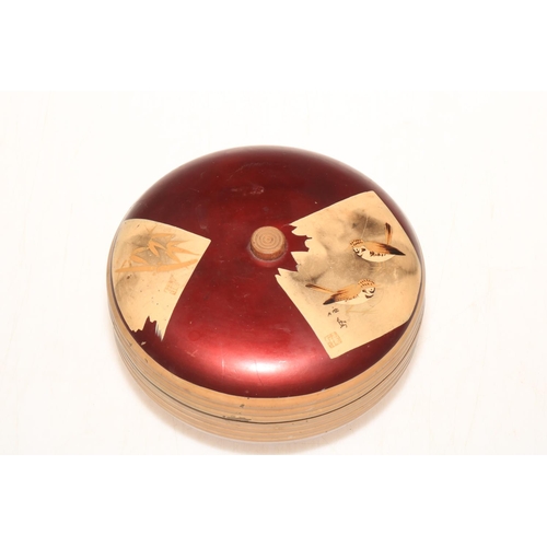 194 - Japanese lacquered wood circular box decorated with birds on bamboo, signed and red seal mark.