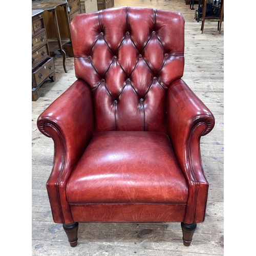 344 - Laura Ashley red buttoned leather armchair.