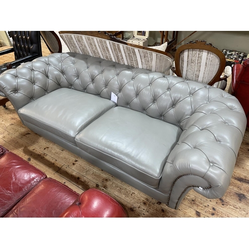 346 - Grey deep buttoned and studded leather three seater Chesterfield settee, 246cm in length.