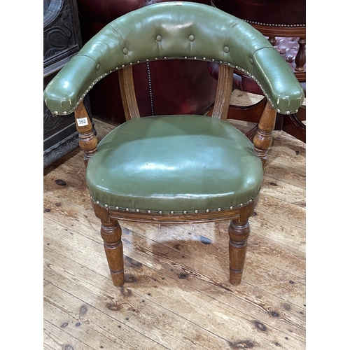 352 - Victorian oak and green leather club chair.