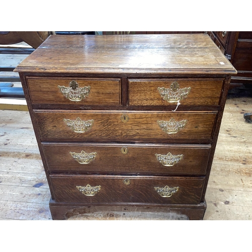 385 - Georgian oak chest of two short above three long graduated drawers on bracket feet with pierced bras... 