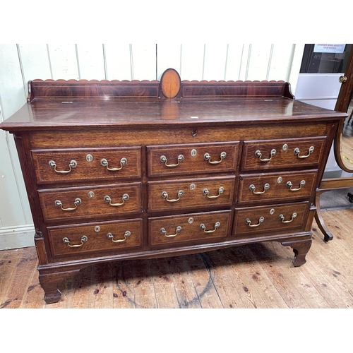 395 - Antique oak and mahogany crossbanded nine drawer Lancashire mule chest, 124cm by 157cm by 56cm.