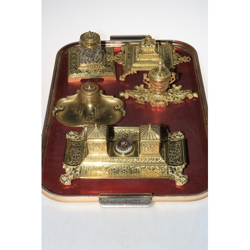 58 - Five ornate brass inkstands.