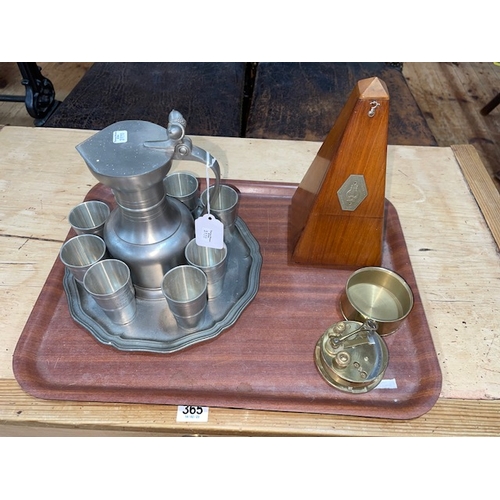 61 - Baehler pewter jug, eight beakers and tray, metronome, and brass sextant.