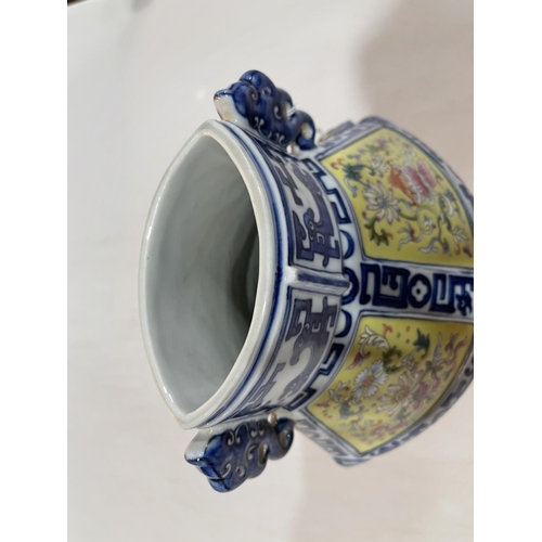 142 - Good Chinese porcelain vase with famille rose on yellow panels and blue and white borders, seal mark... 