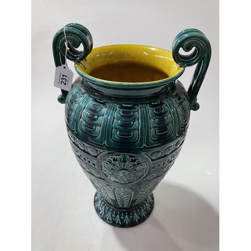 231 - Linthorpe large two handled vase in turquoise glaze and moulded with stylised foliage, no. 2059, 44.... 