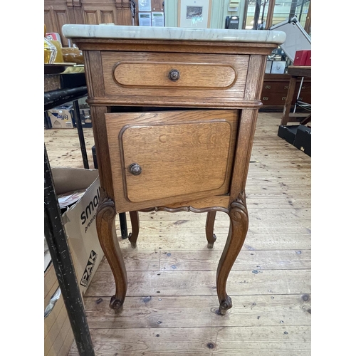 395 - Pair Continental oak and marble topped bedside cabinets, 82cm by 42cm by 38cm.