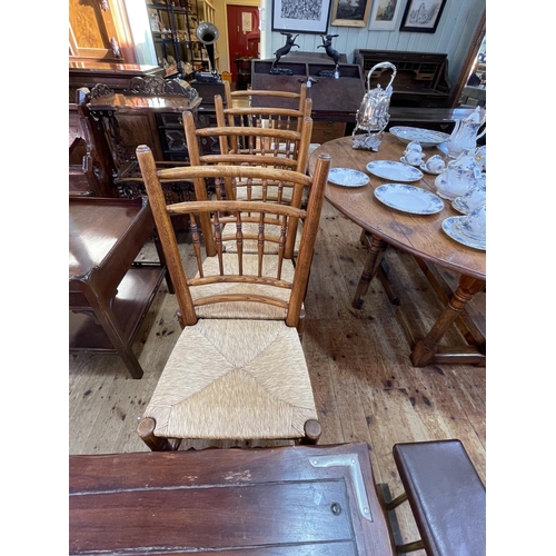 418 - Jointed oak gate leg dining table and eight country style rush seated dining chairs including pair c... 