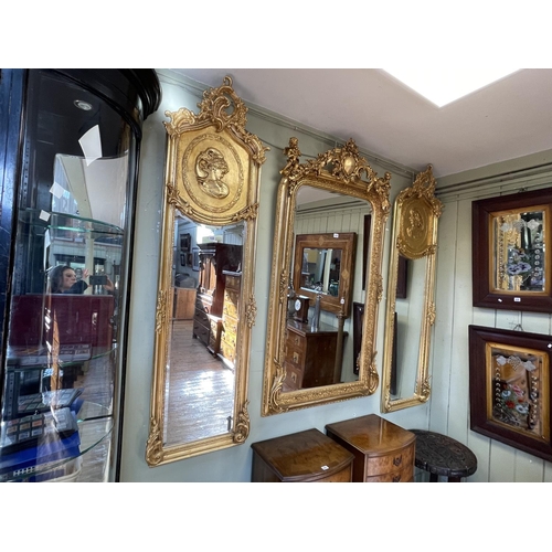 438 - Pair rectangular gilt framed lady portrait bevelled wall mirrors, 180cm by 53cm.