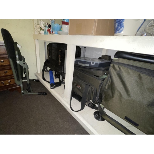 103 - Large collection of fishing equipment including rods, landing nets, tackle boxes and bags, seat, car... 