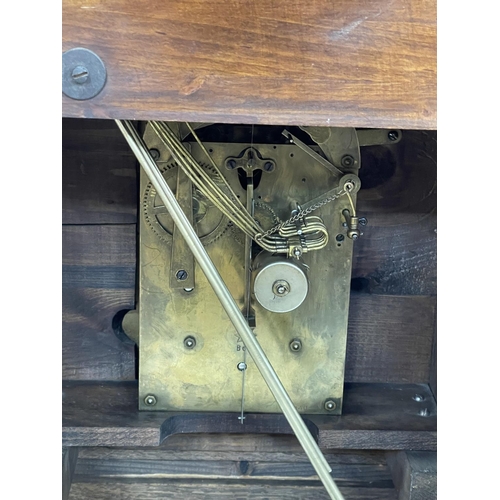 132 - Oak cased bracket clock with brass and silvered dial, movement stamped Junghaus B07, 41cm high.