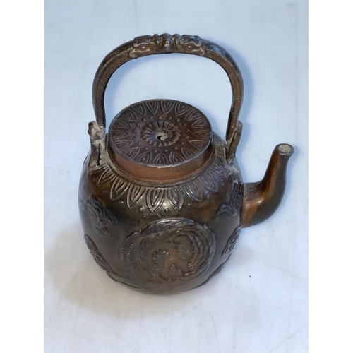 174 - 19th Century Chinese bronze water dropper in the form of a teapot decorated with embossed dragon and... 