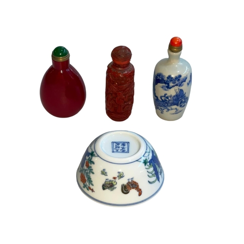 175 - Chinese Cinnabar and two other opium bottles and small tea bowl decorated with chickens and flowers.