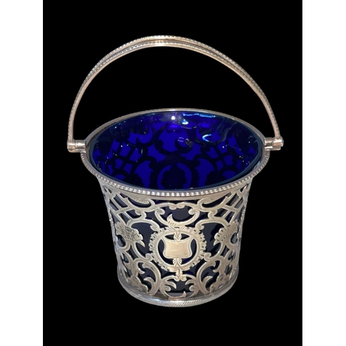 219 - Edwardian silver pierced and engraved basket with blue glass liner, Birmingham 1907, 11cm to top of ... 