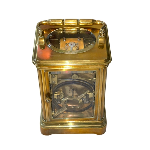 235 - Gilt brass carriage clock with striking movement, 14cm.