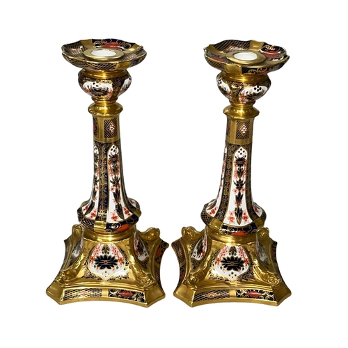 254 - Pair Royal Crown Derby Imari candlesticks, 26cm.