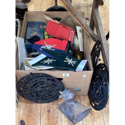 50 - Box with trivets, pennants, miscellaneous.